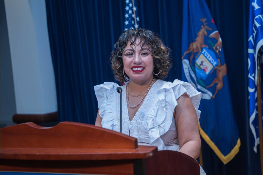 Woman smiling at podium